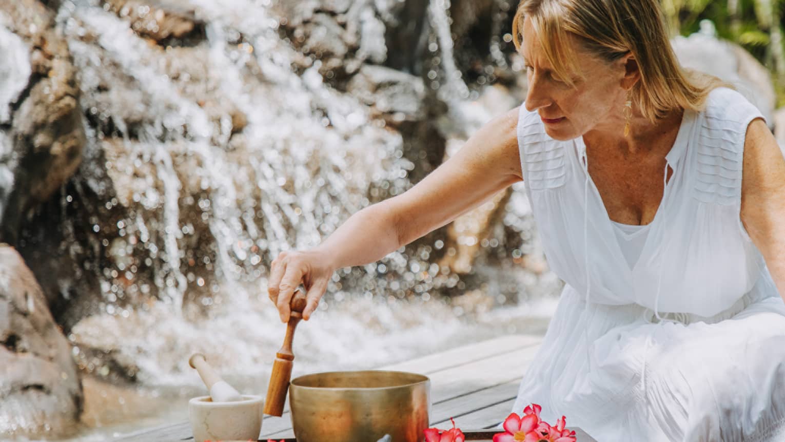 Resident spa intuitive Maryanne Rose leading a vibrational forest essence session, focusing on energy work