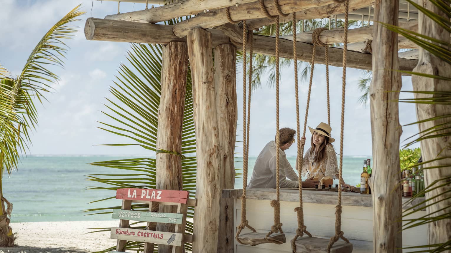 Couple relaxes outdoors at La Plaz Beach Bar