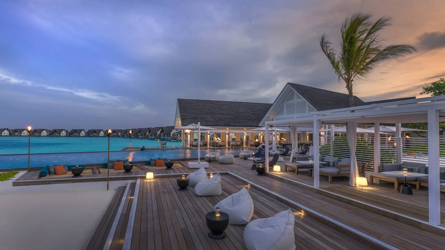 Beanbag chairs arranged outside the Blu Beach Club int he Maldives