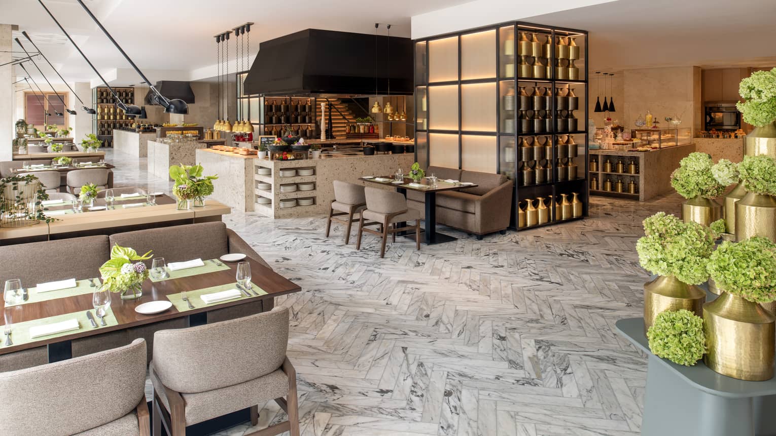 Interior of restaurant with square tables, natural light and grey patterned floor