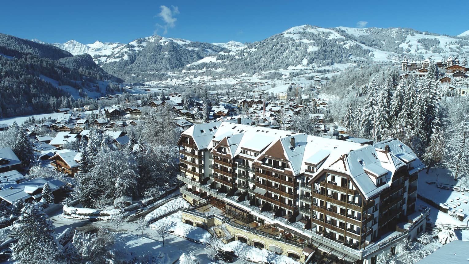 Aerial rendering of the residence building and surrounding snowy mountains