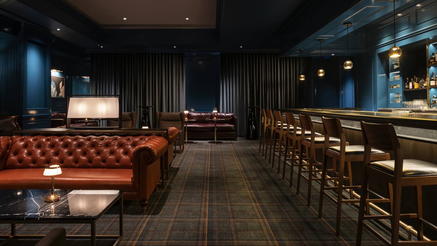 A dimly lit bar is ready for guests at Four Seasons Westlake Village