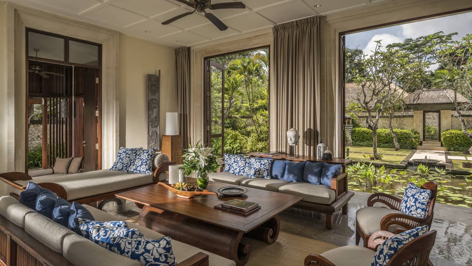 Sofas, table in open-air three-bedroom garden residence villa living room