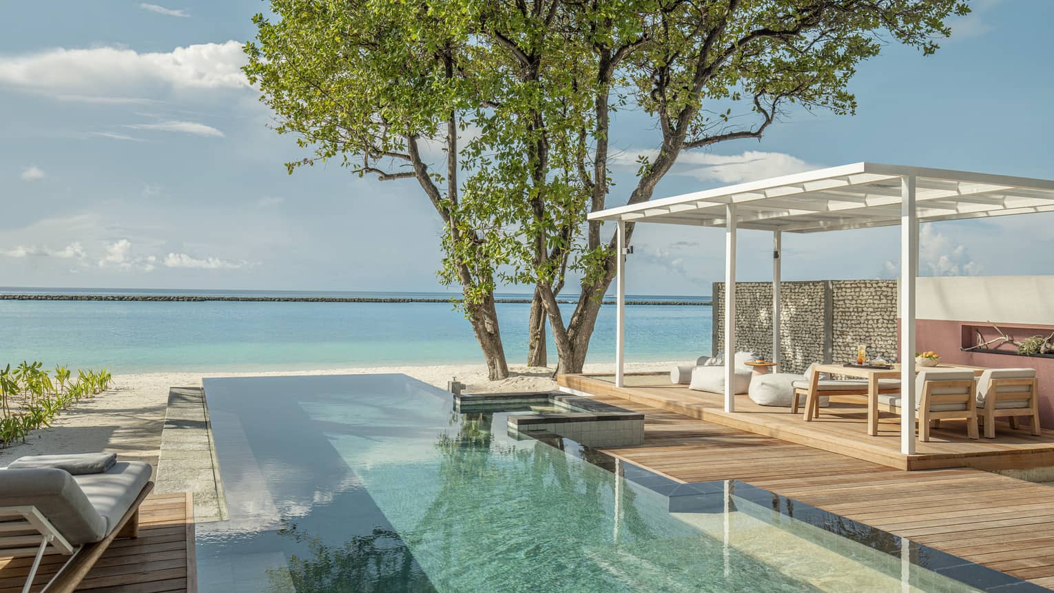 Private pool and lounge deck overlooking Maldivian ocean