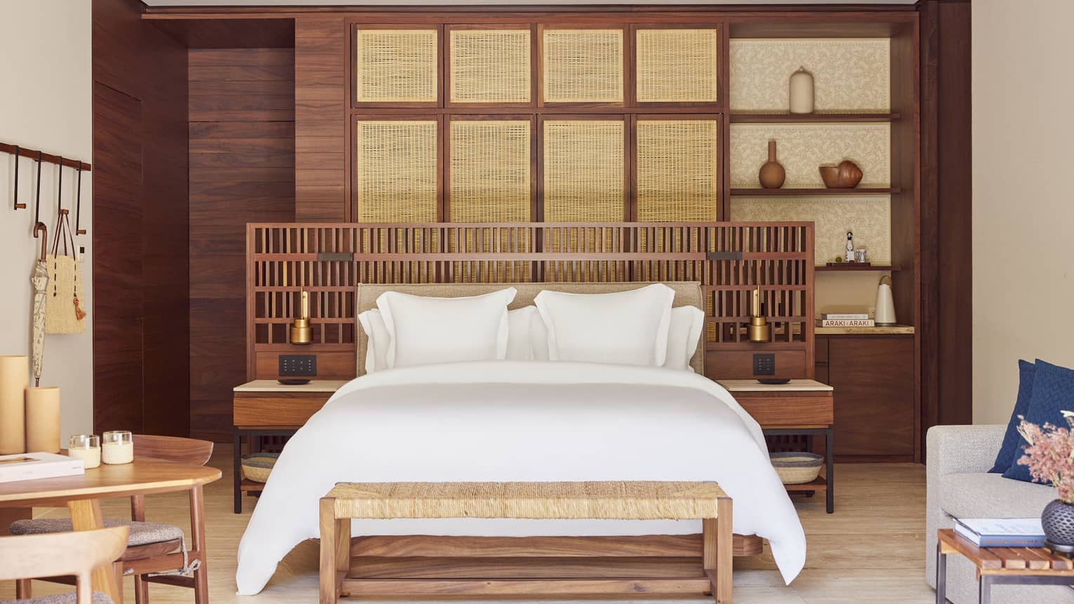 Resort bedroom with king bed and sleek, wooden furnishings