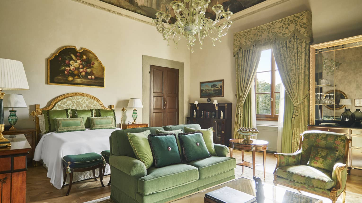 Renaissance Suite king bedroom with frescoed ceiling and chandelier, at Four Seasons Hotel Florence