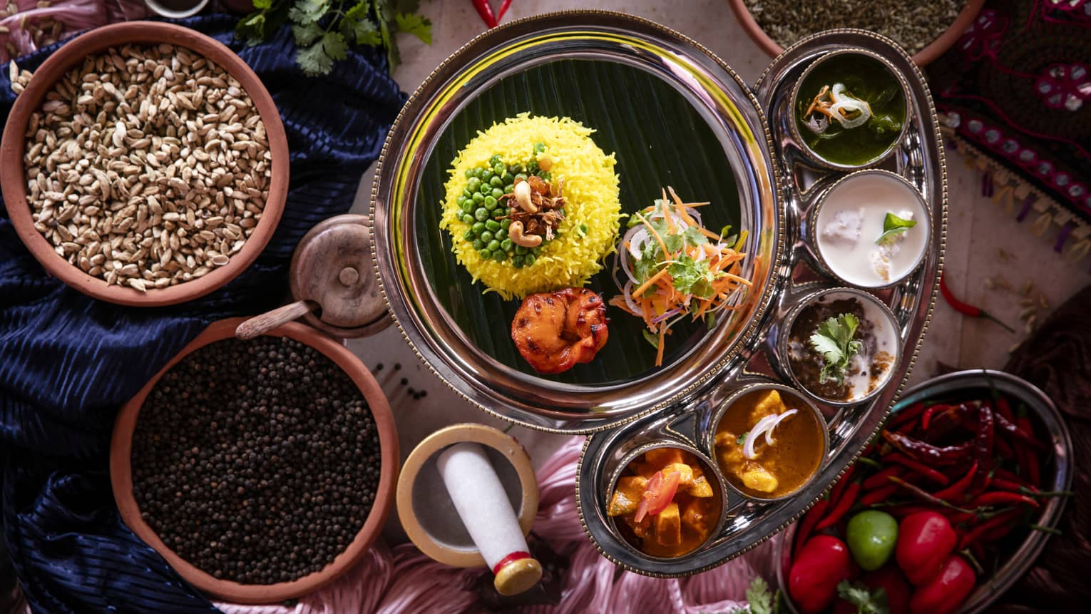 An aerial view of an assortment of Indian food at Baraabaru Indian Thali
