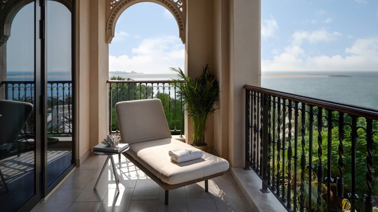 Balcony with lounge chair and sea view