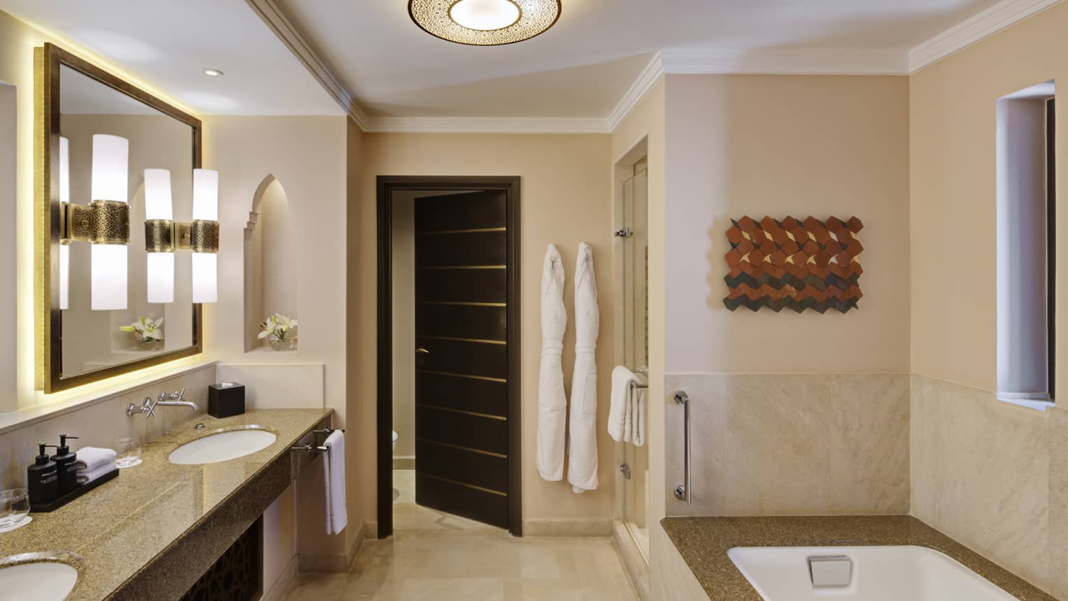 Large bathroom with tub and double vanity