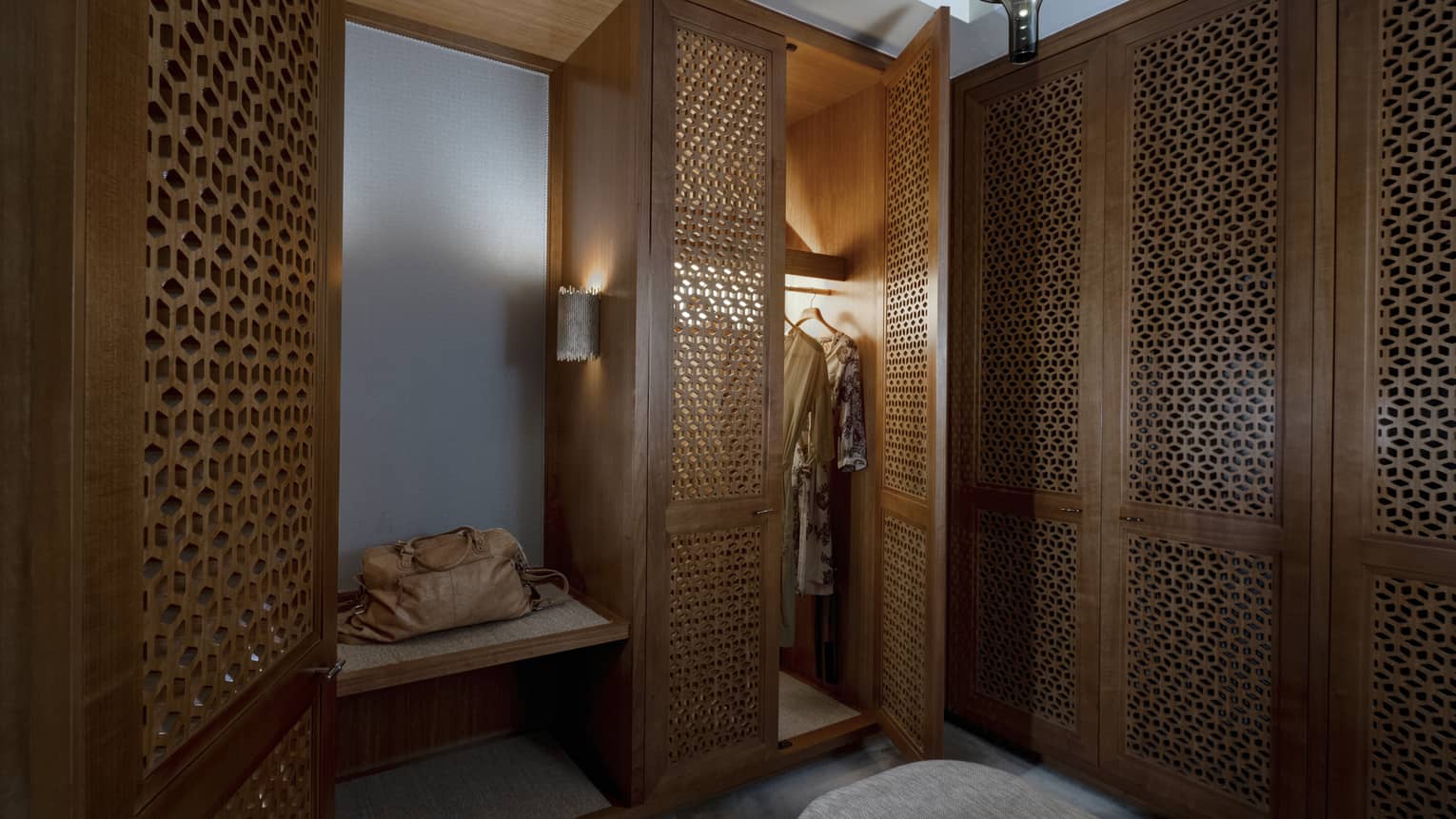 Walk-in closet with detailed wooden doors