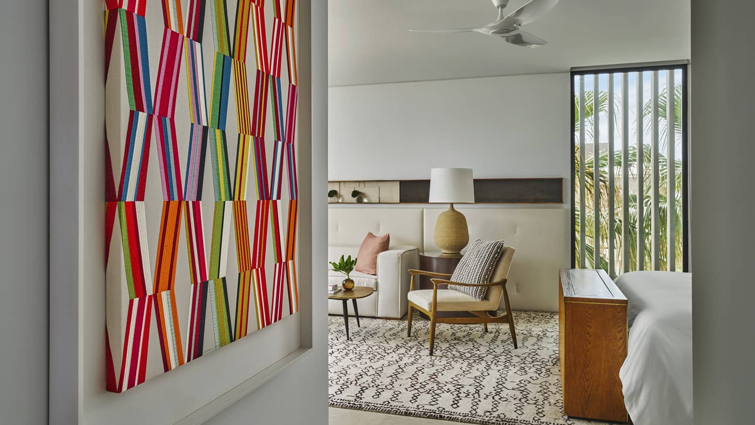 Colouful artwork hangs on wall in one-bedroom suite at Four Seasons Resort Los Cabos