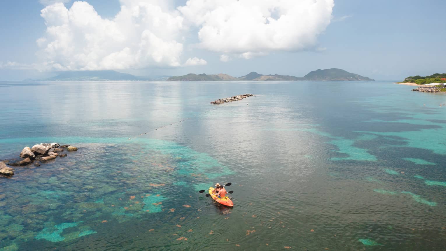 A kayak out on water.