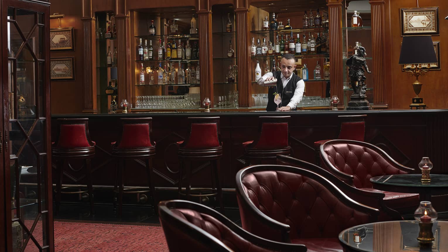 Bartender mixes drink at Le Bar