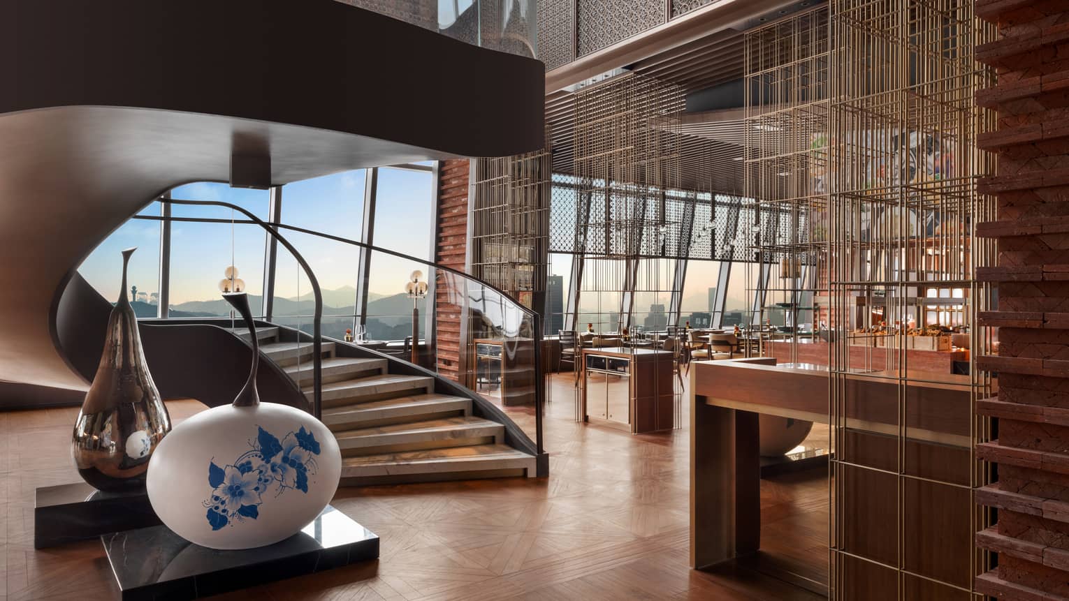 Restaurant at Four Seasons Hotel Dalian, with grand staircase and wall of windows
