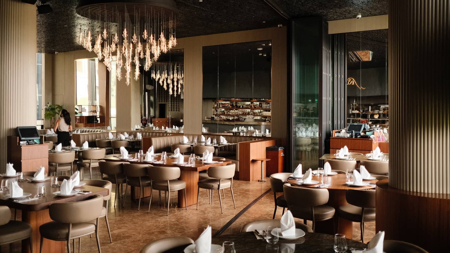 Indoor dining tables at Nusr-Et, with large showpiece chandelier