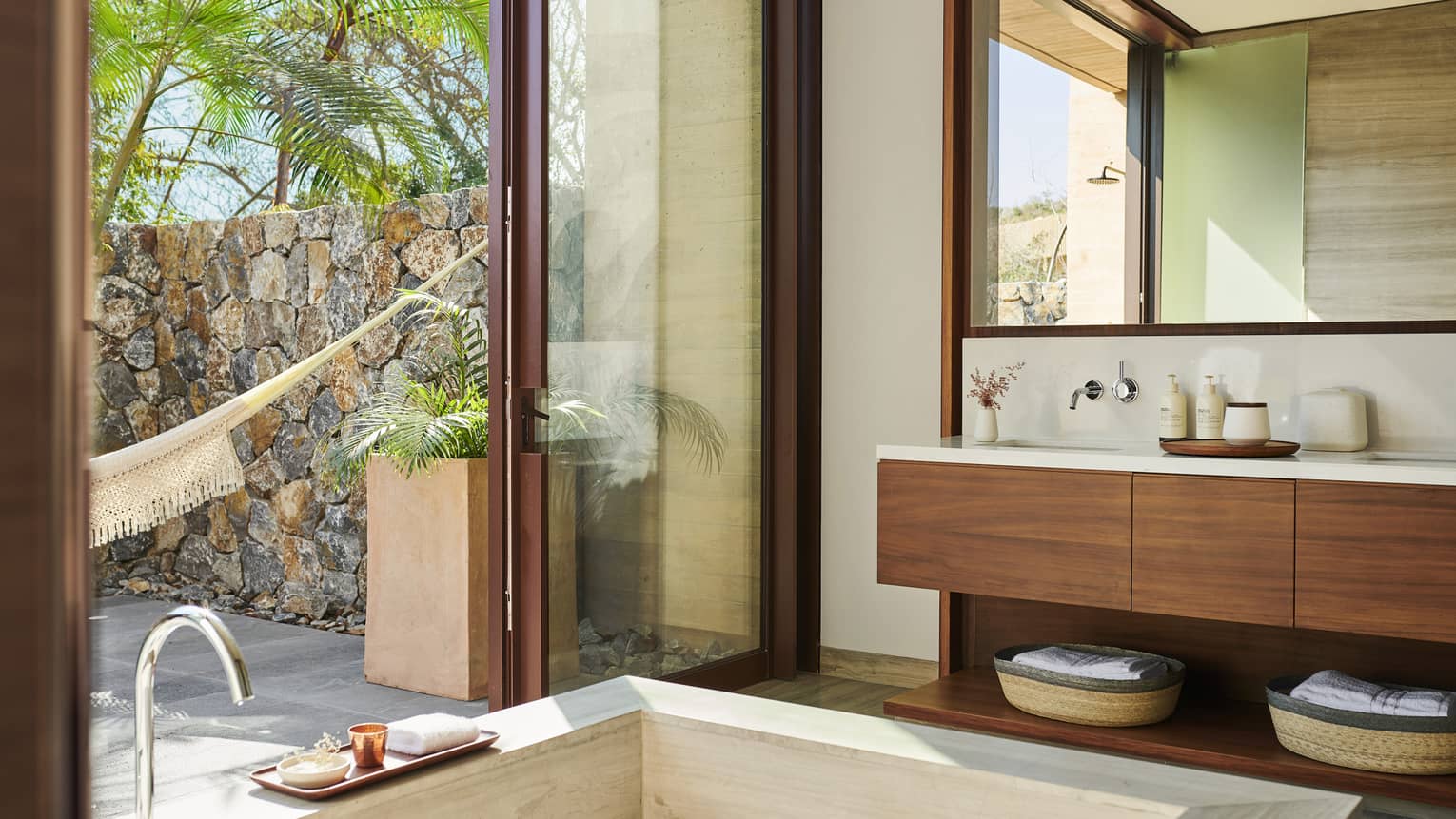 Modern, indoor-open bathroom with square tub