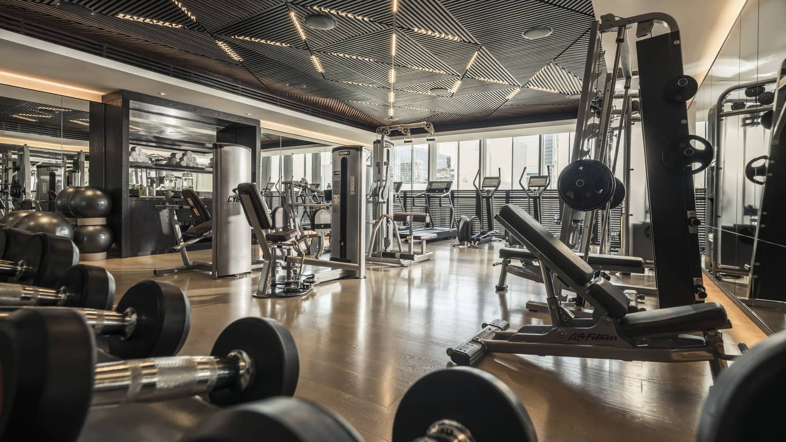Cardio machines and weight stations line the Fitness Centre