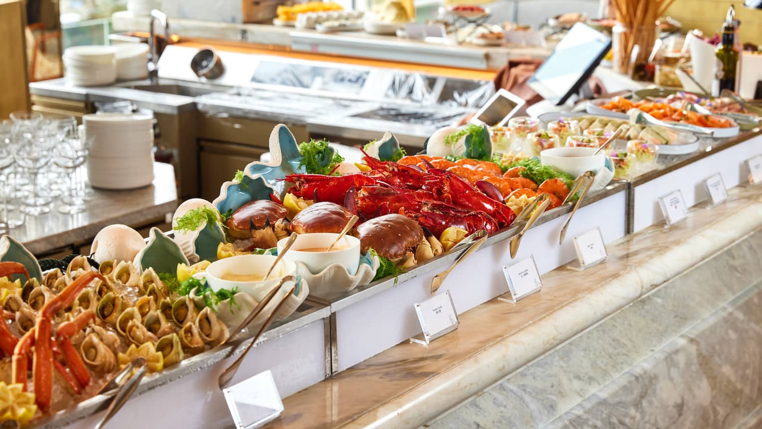 Elaborate lunch buffet spread in a sun-lit restaurant