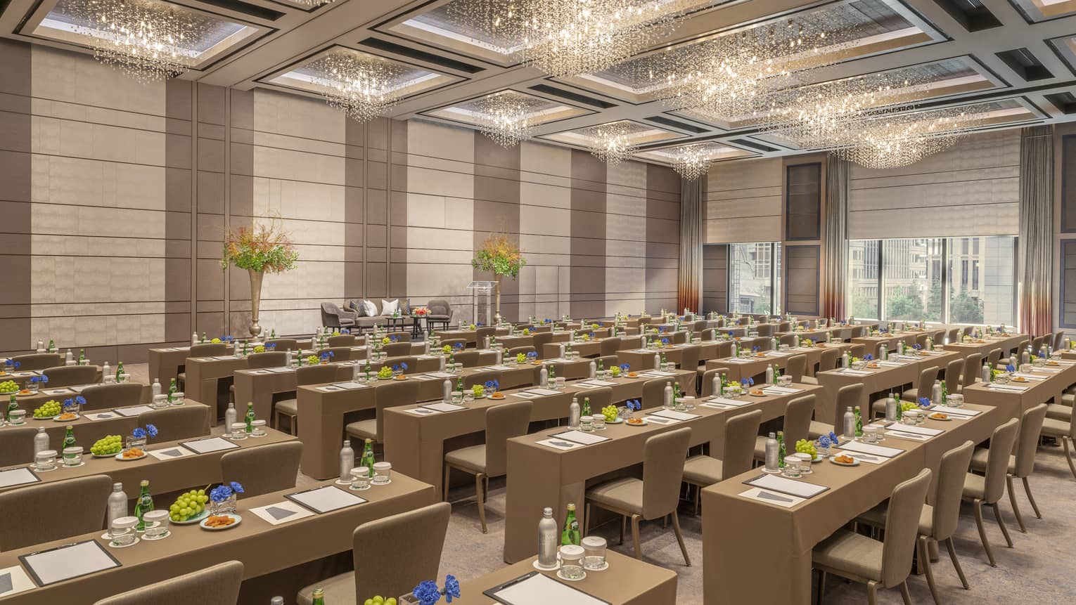Ballroom set classroom style with gold accents and high ceilings