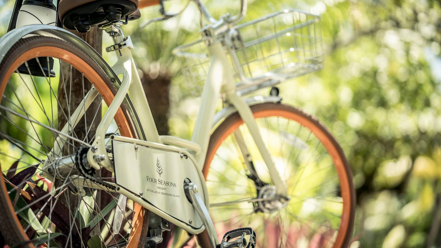 White vintage style bicycle with Four Seasons Hotels logo