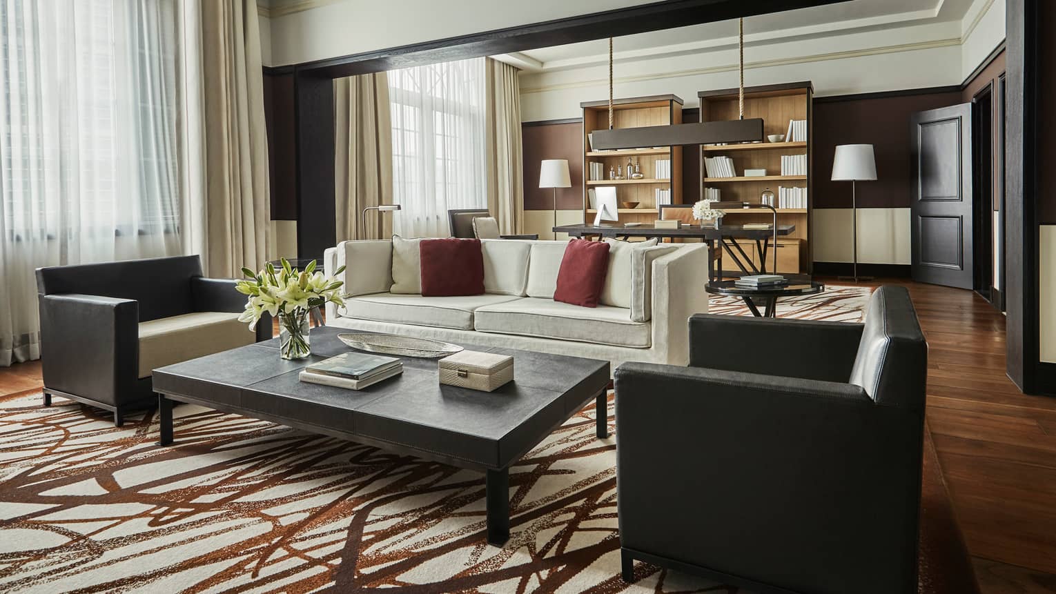Bright Governor Suite sofa and two armchairs by coffee table, brown-and-white rug