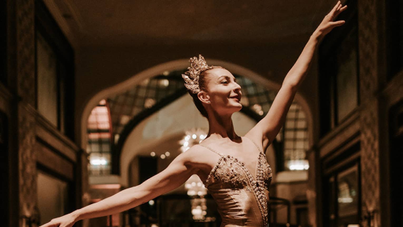 Ballerina in gold costume on pointe
