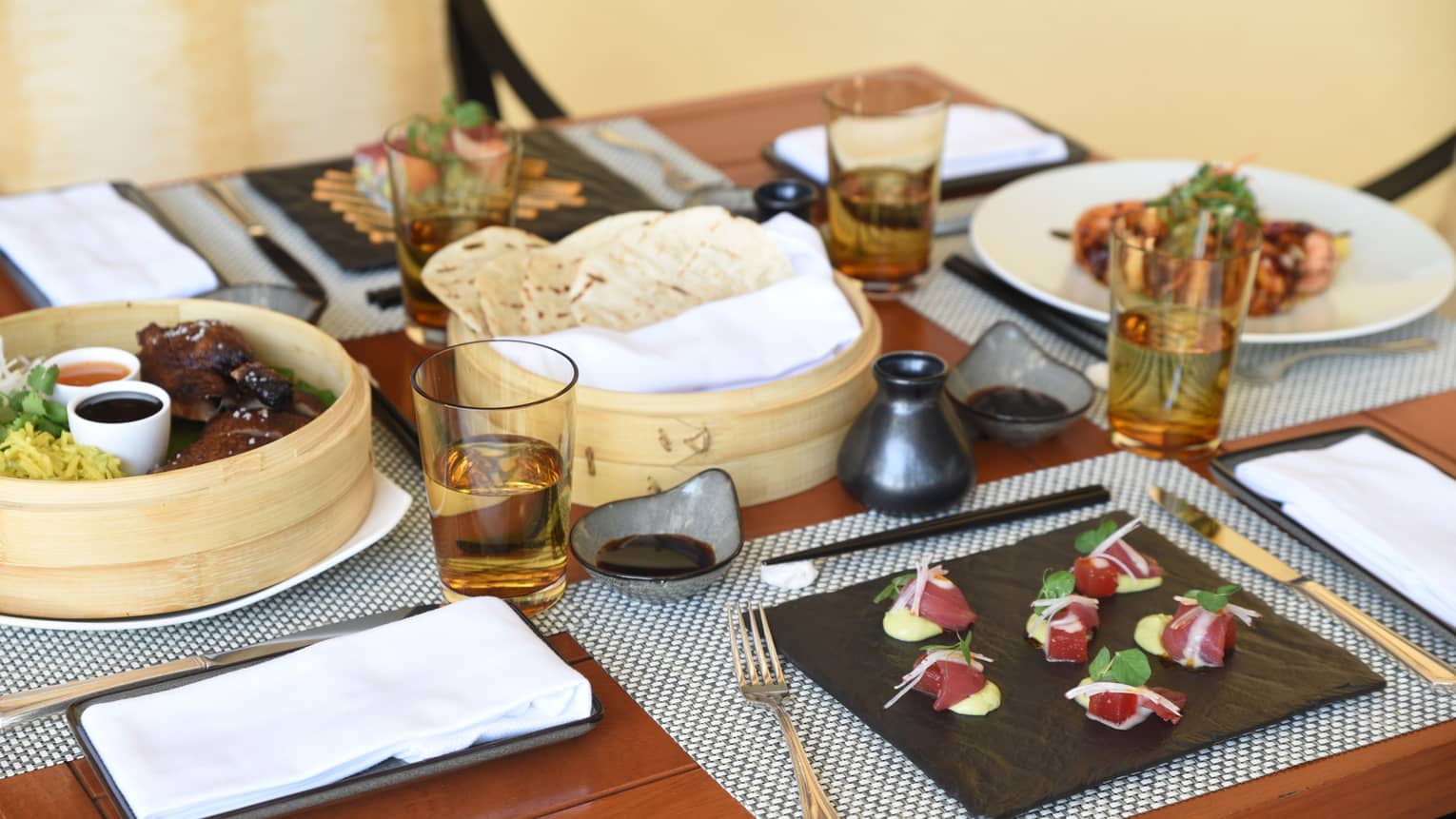 Close-up of gourmet appetizers on Metzeri at Aramara Restaurant private dining table