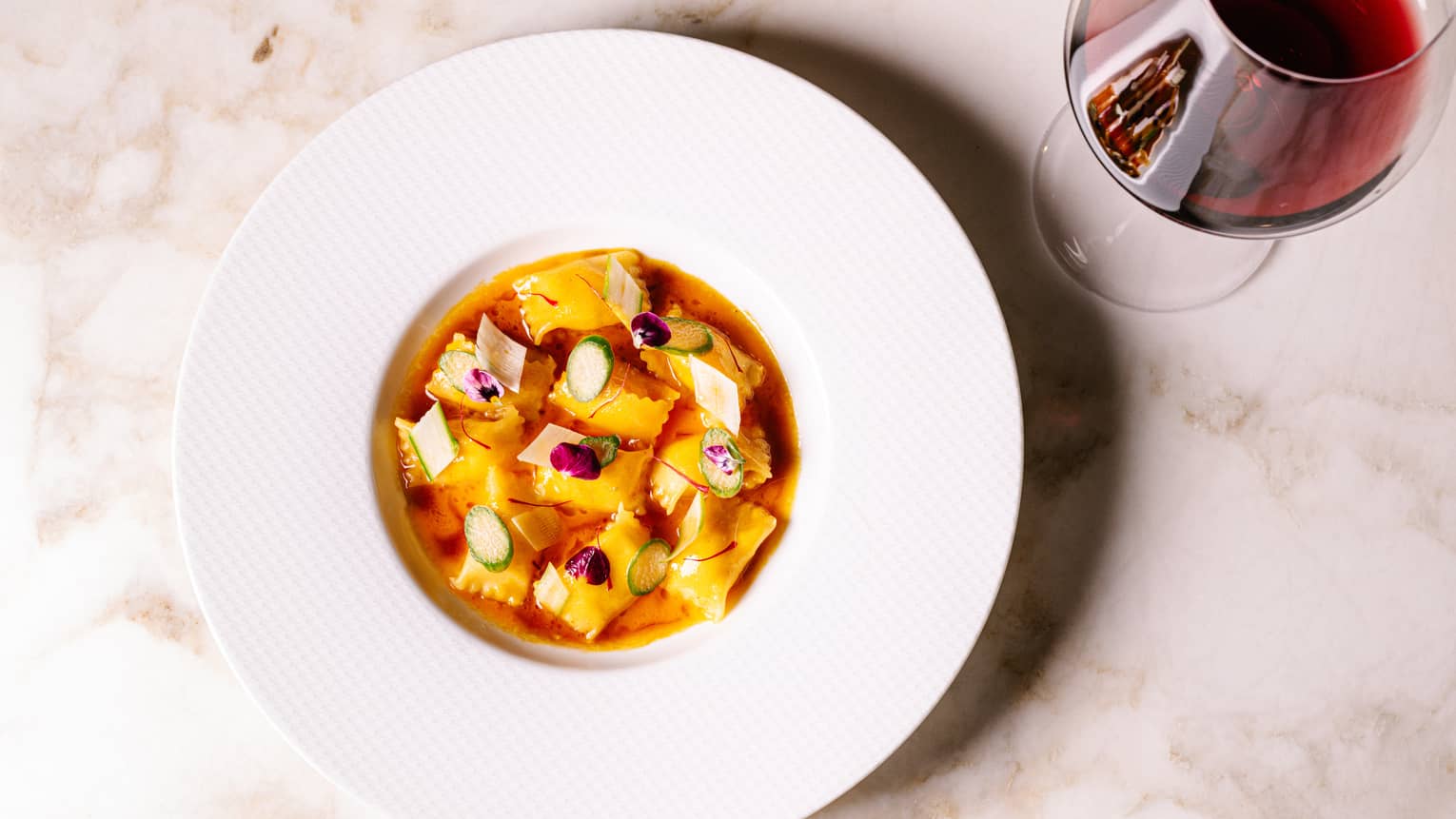 Bowl of Ravioli with Saffron, Asparagus and Veal Jus