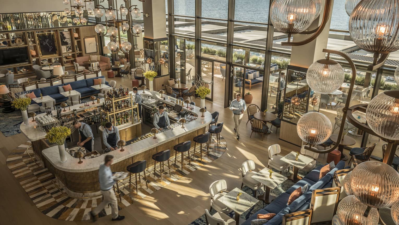 Aerial view of a contemporary restaurant with two-storey windows looking out to sea