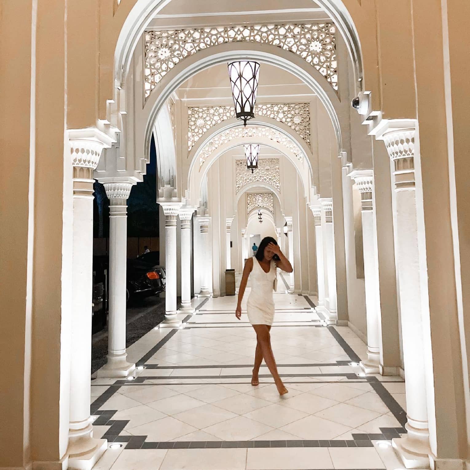 Lady in middle of Dubai resort hallway,lady in middle of dubai resort hallway