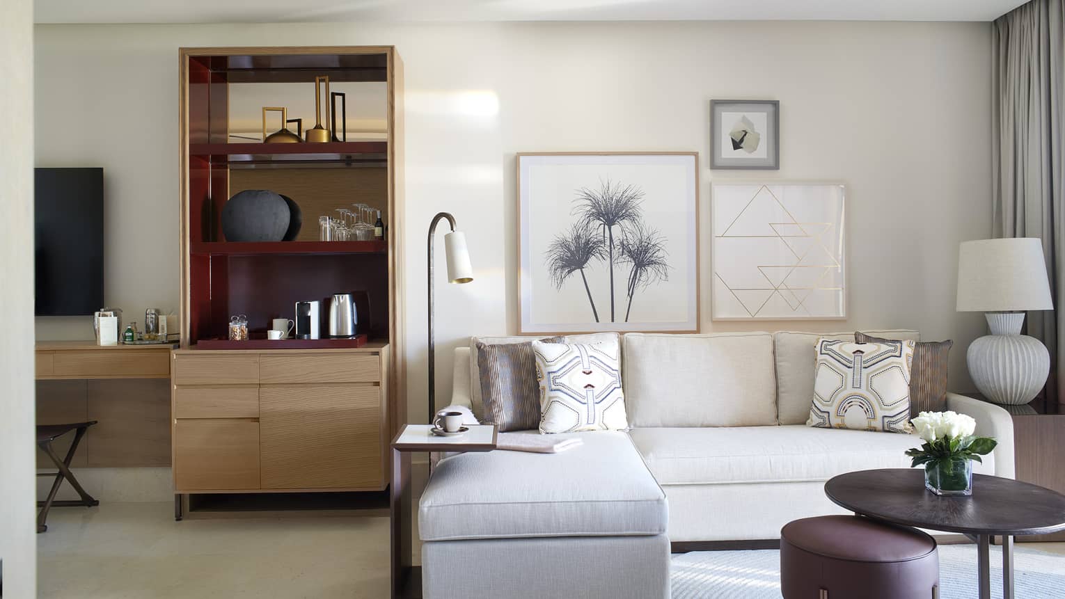 Sitting area with white sofa and wet bar area