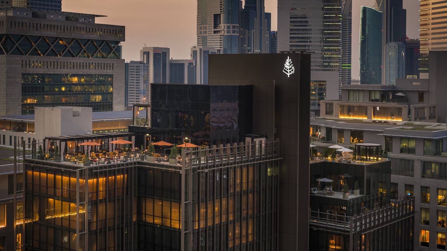 Exterior view of the rooftop of Four Seasons Hotel Dubai International Financial Centre with the skyline in the background