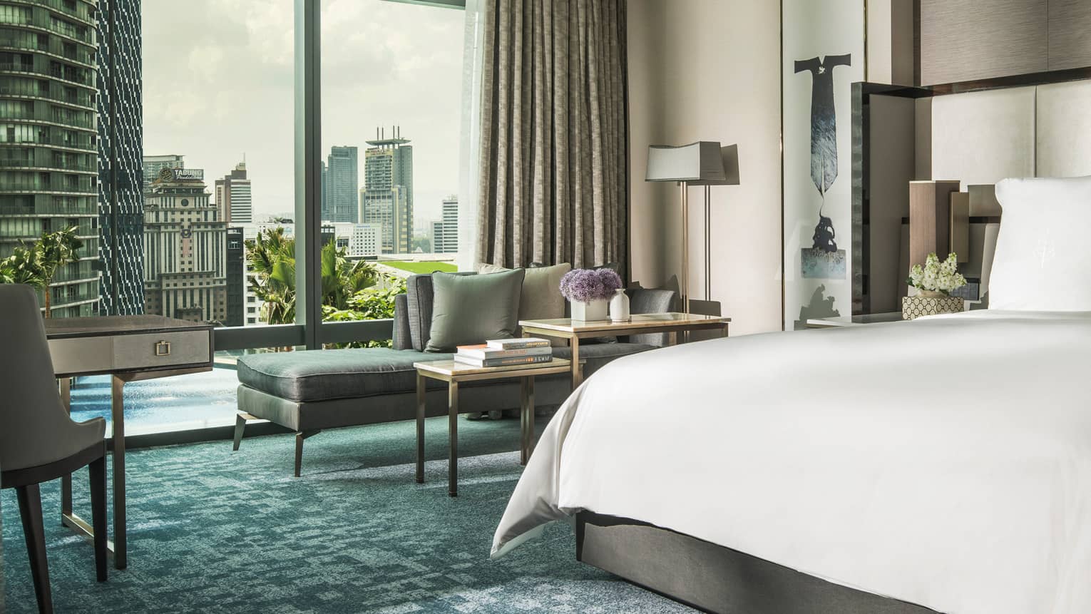 Deluxe King Pool Garden View with city skyline through the window