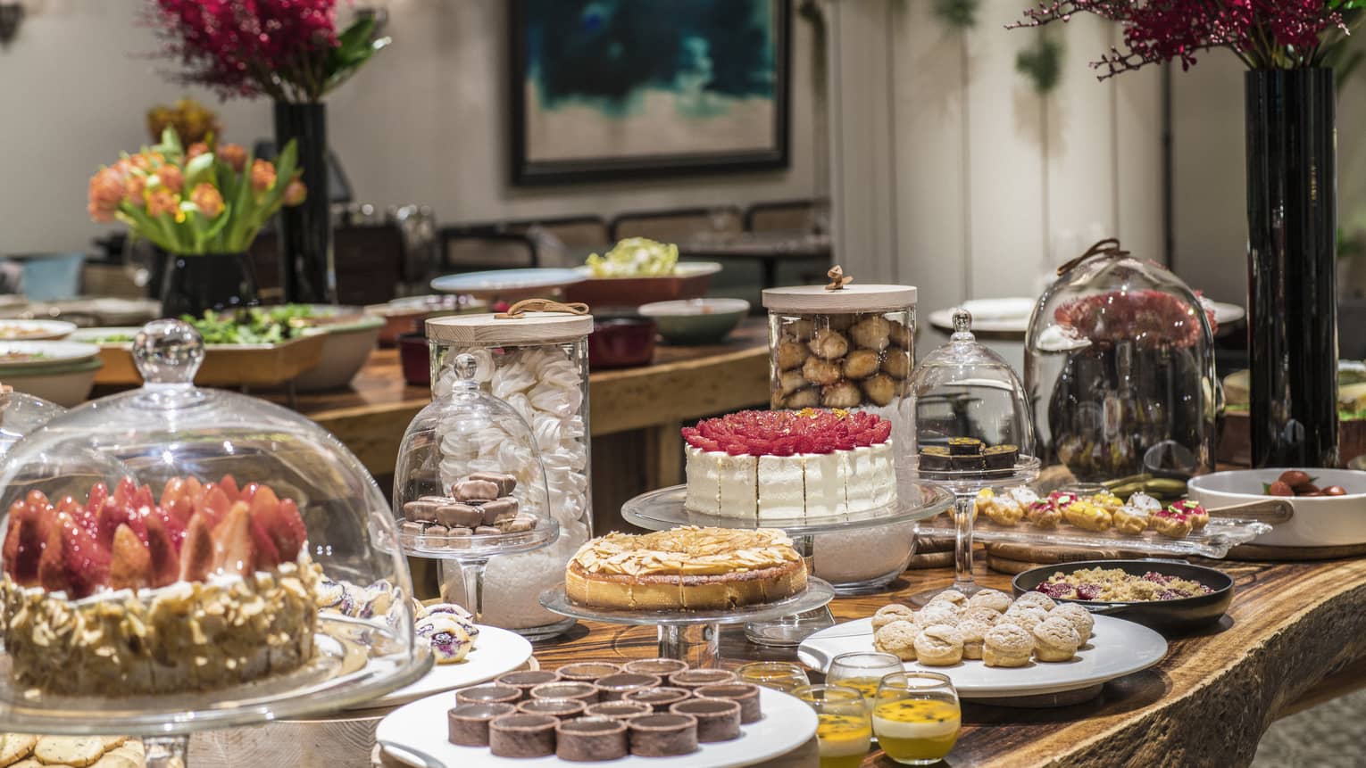 An arrangement of a variety of decadent desserts including cakes, tarts and soufflés