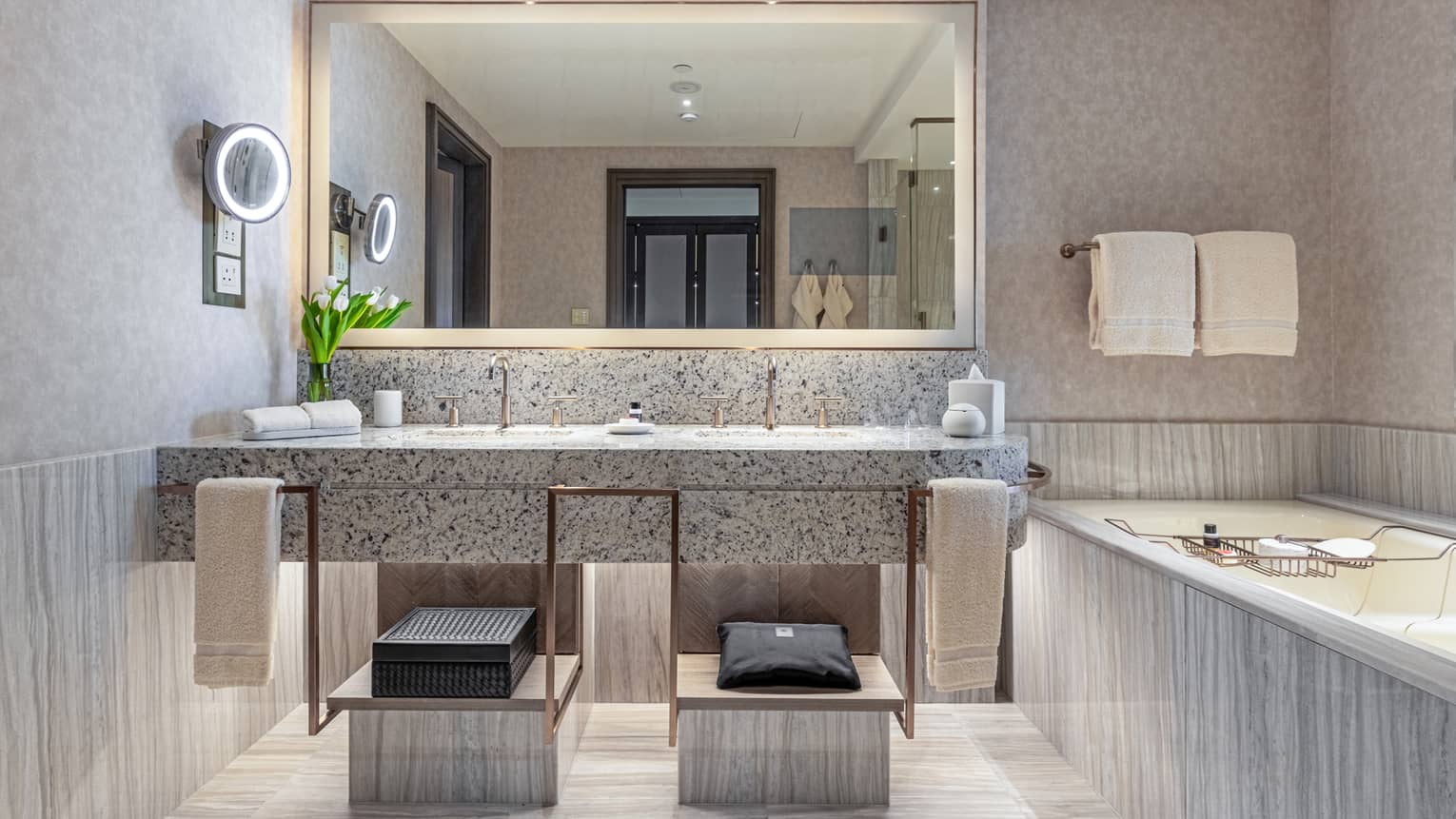 A grey marble bathroom.