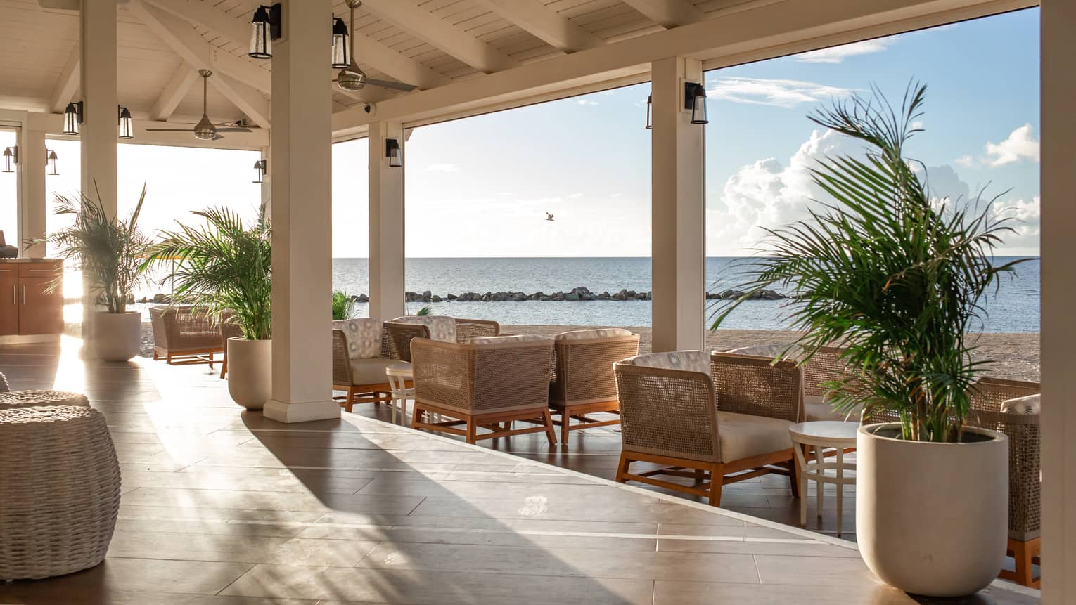 A dining outlet open to a beach outside.