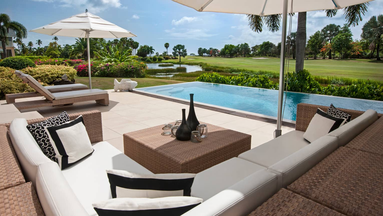 Palm Grove Residence Villa L-shaped patio sofa, cushions by plunge pool
