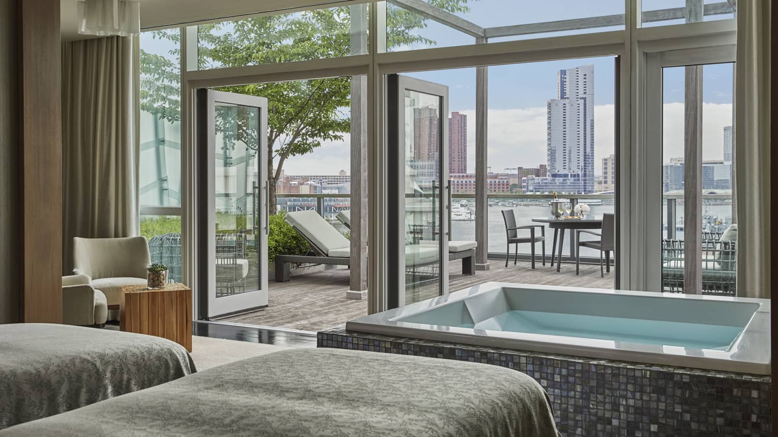 The couple’s VIP Spa suite with a soaking tub and outdoor patio overlooking the harbour