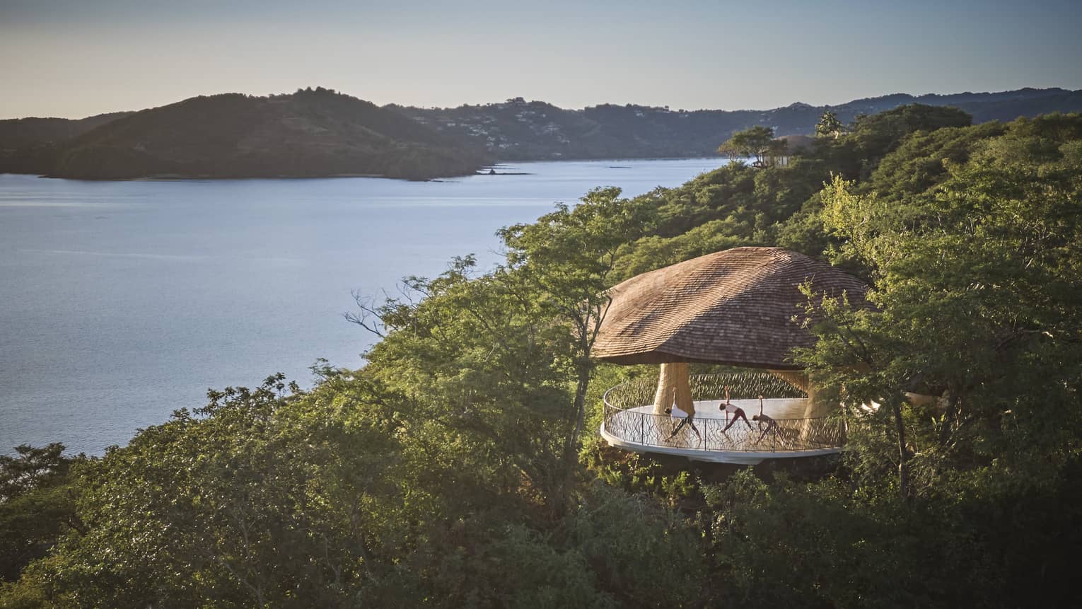 Wellness Shala set on a green hilltop overlooking the ocean