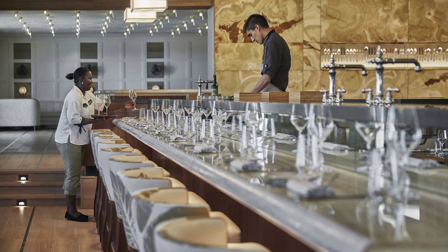 Two team members working in a dining outlet.