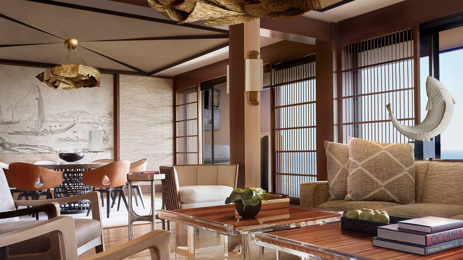 Manele Suite living room with modern furniture with wood accents, shutters, woven pillows