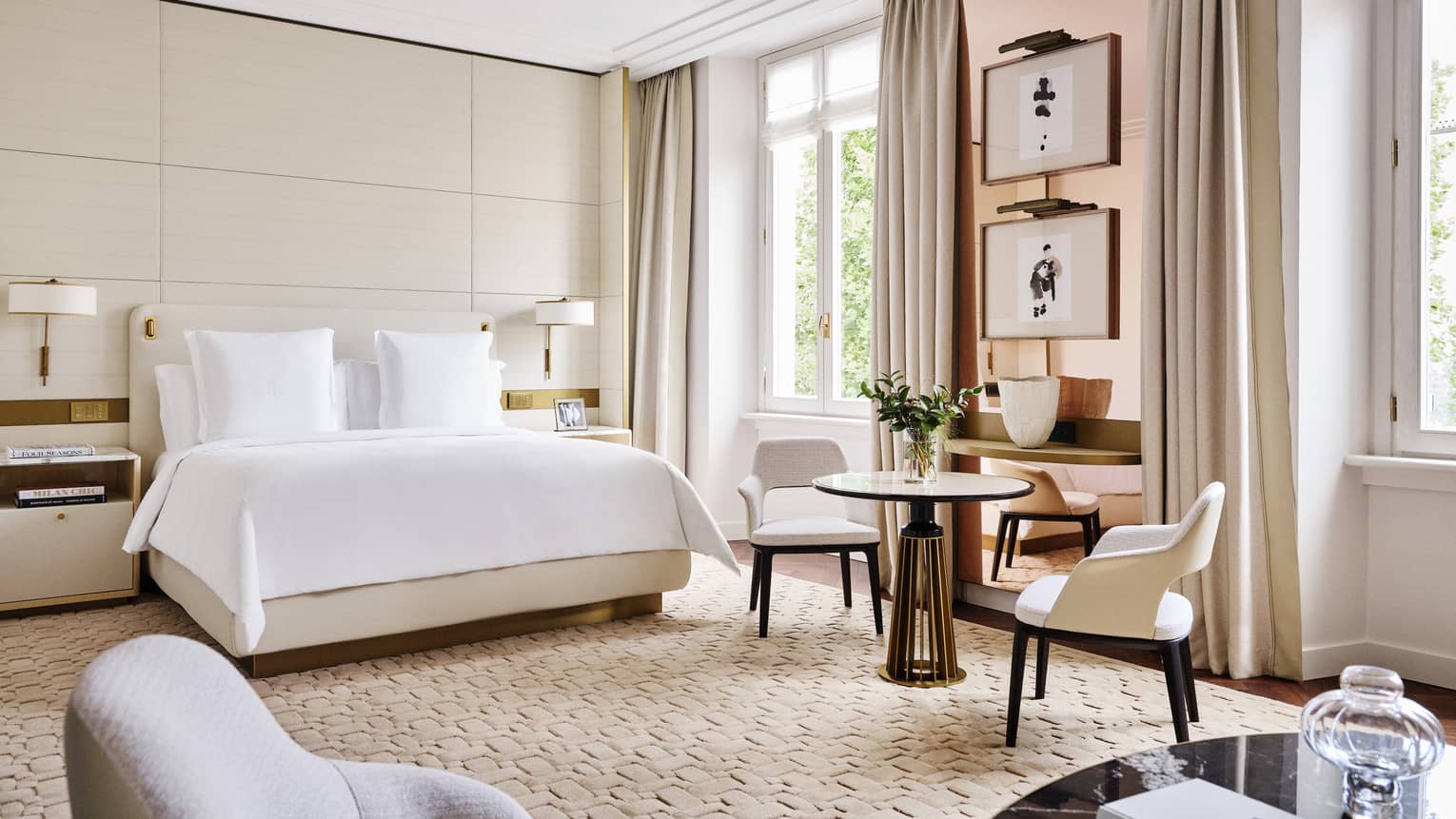 Elegant hotel guest room with king bed and windows