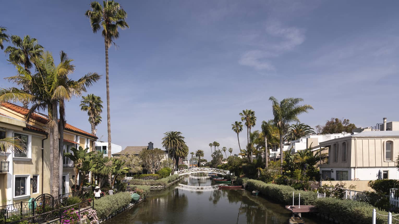 A small waterway with houses lining it.