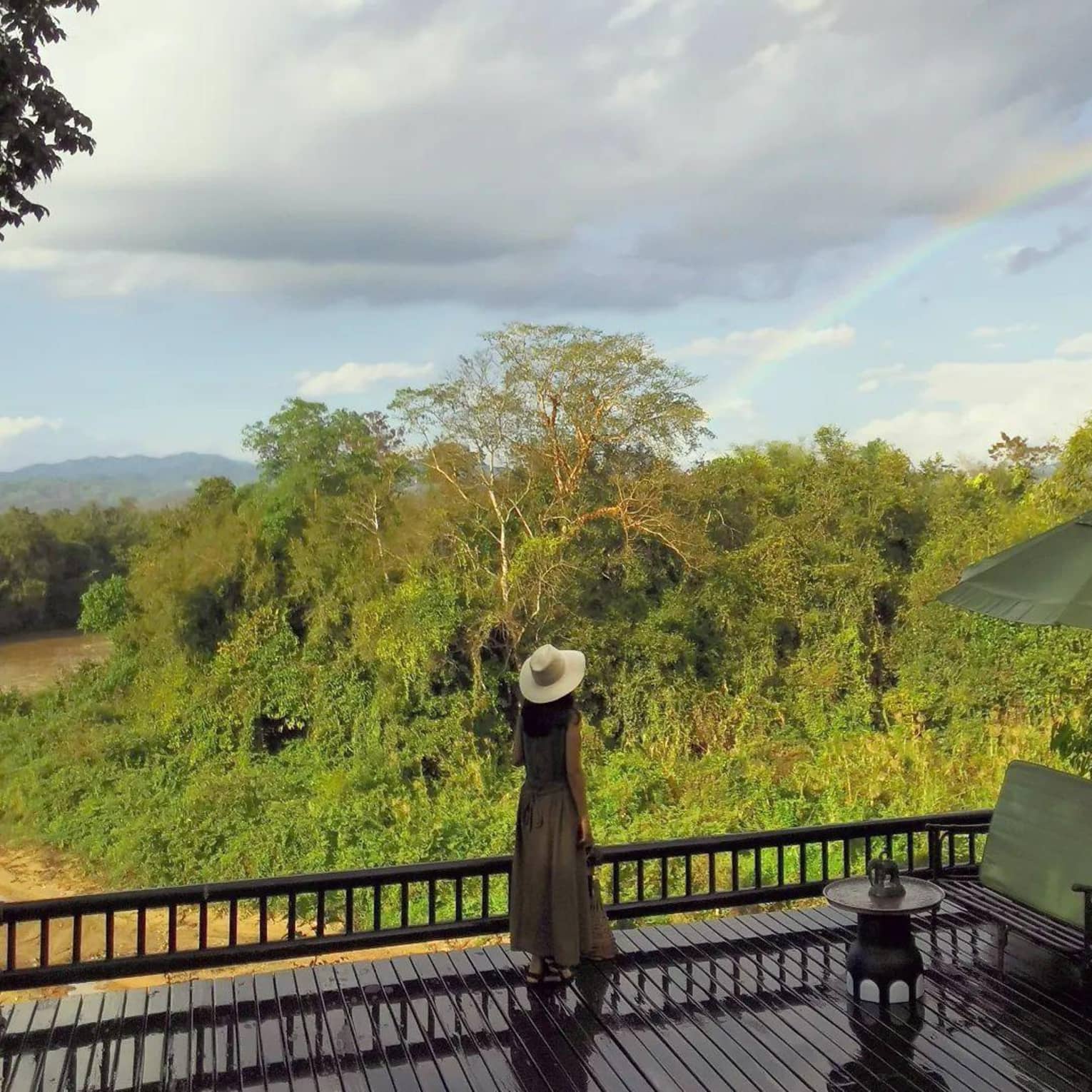 Guest enjoying a lush patio view