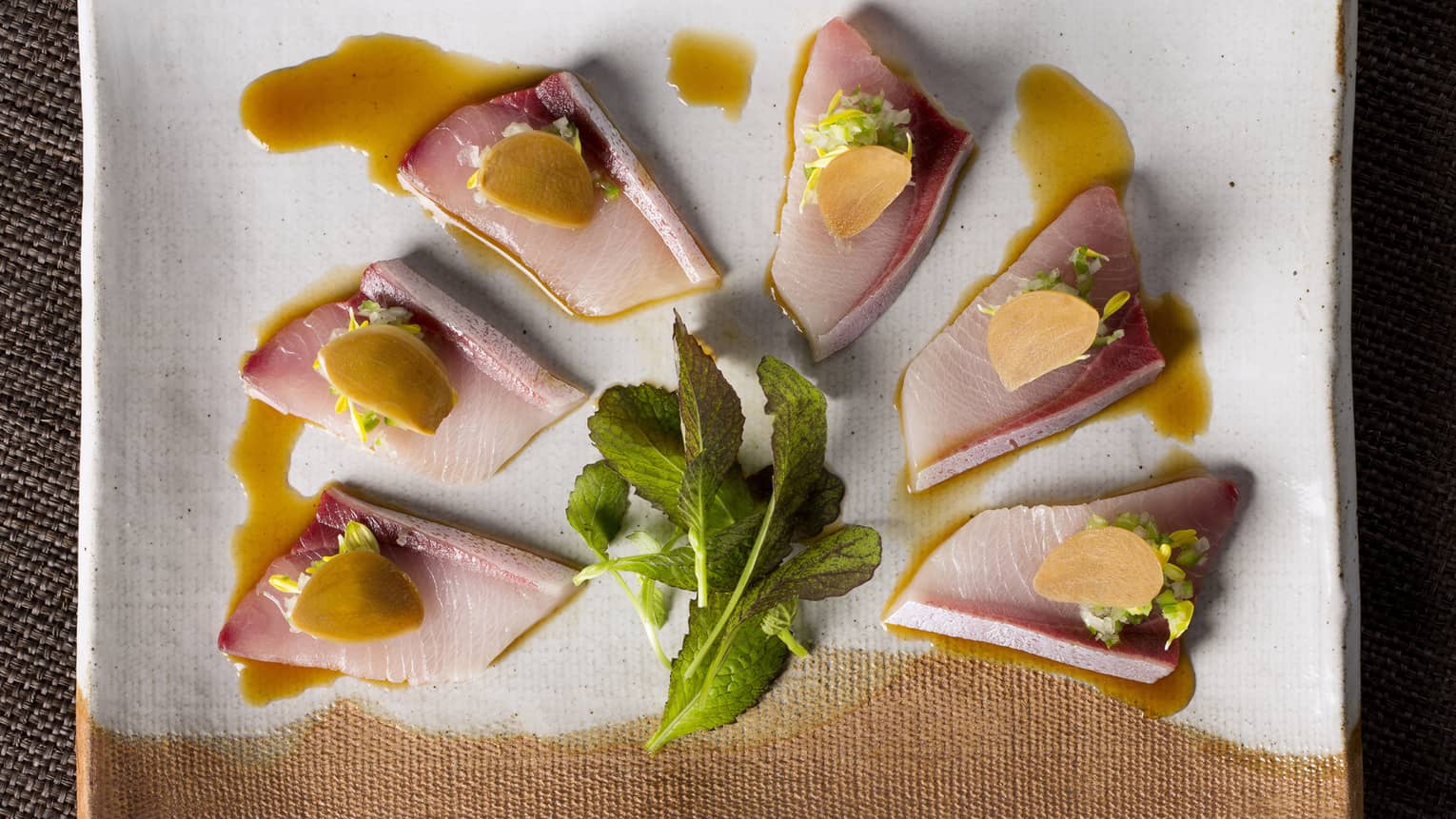Sliced yellowtail with green chilli relish, ponzu and pickled garlic 