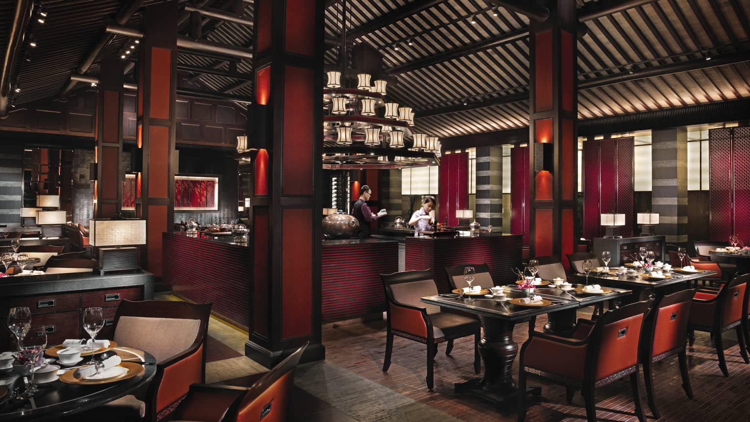 Jin Sha dining room with dark red-and-black decor