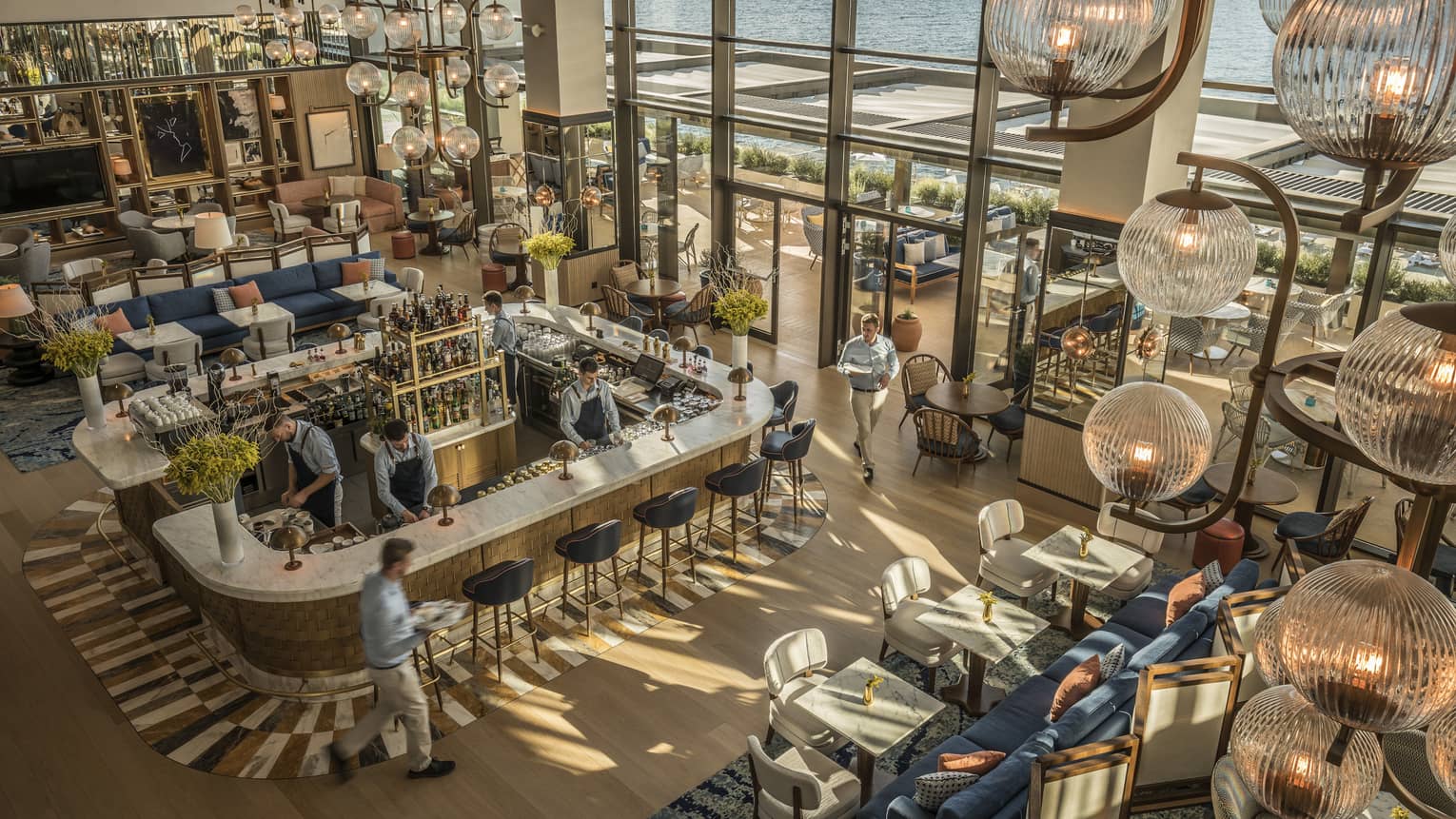Aerial view of a contemporary restaurant with two-storey windows looking out to sea