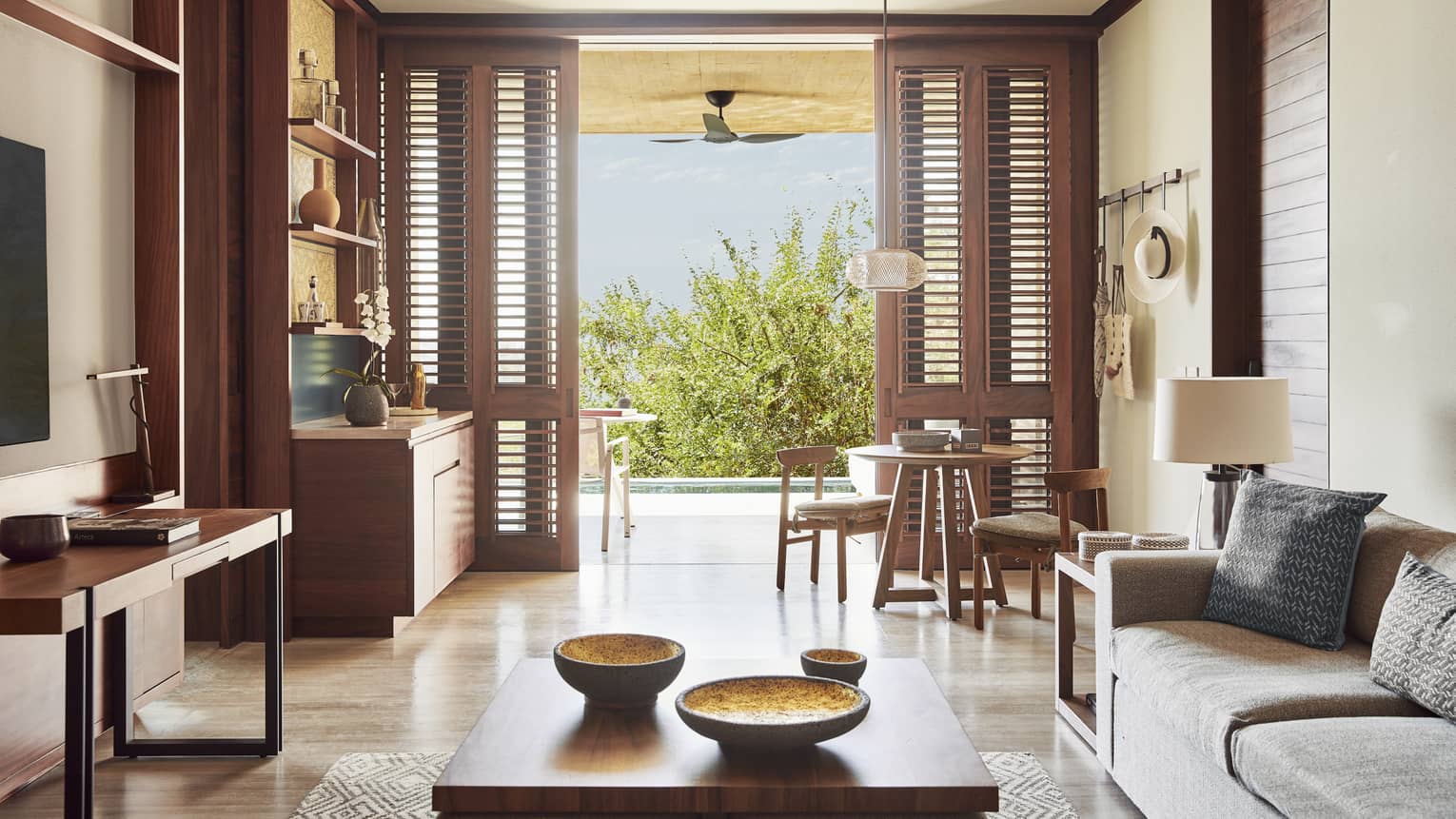 Resort suite living area with walk-out infinity pool terrace