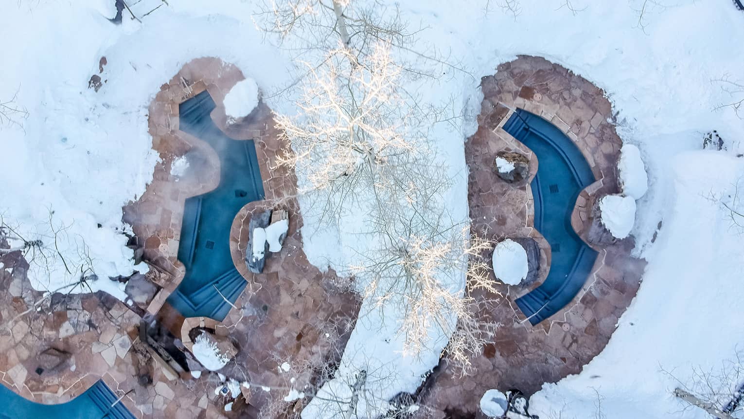 A snow covered pool area.