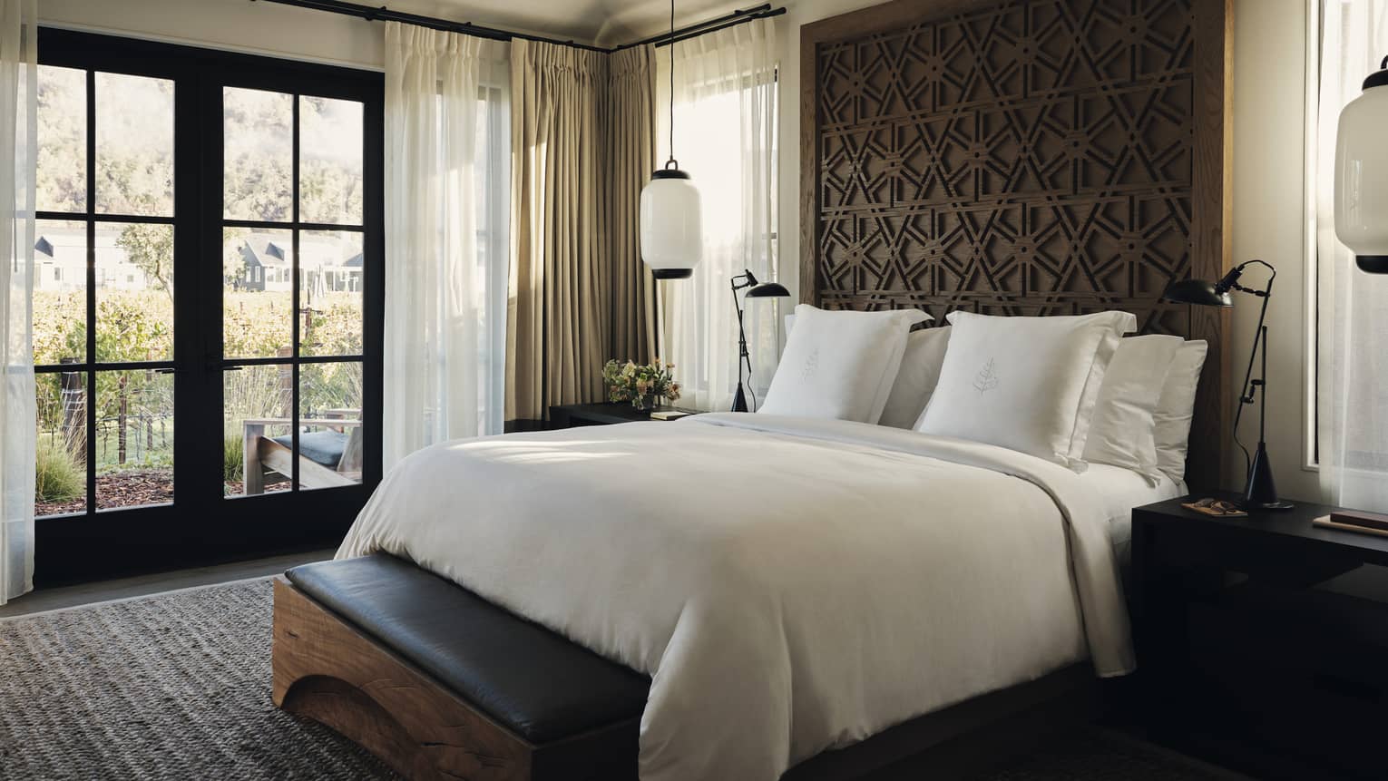 Bedroom with large bed and walkout to terrace